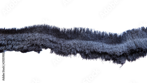 Foto Isolated dark textured abstract material, resembling furry brush bristles or shaggy fringe