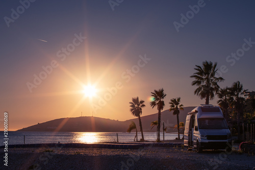 Camper van sunset on the beach