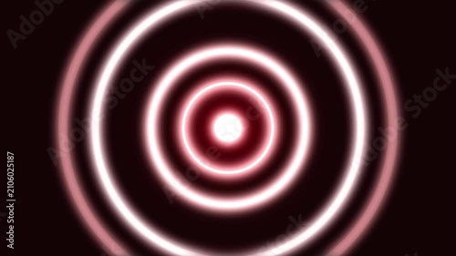 Fiery red and white glowing concentric circles radiate from an intense central light, forming a powerful abstract pattern on a deep red-black background.