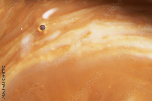 Close up of milk on black tea