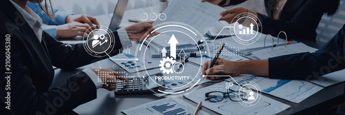 Tableau sur toile Business meeting on productivity enhancement with graphs and charts displaying growth, teamwork and technology in a corporate setting Trope