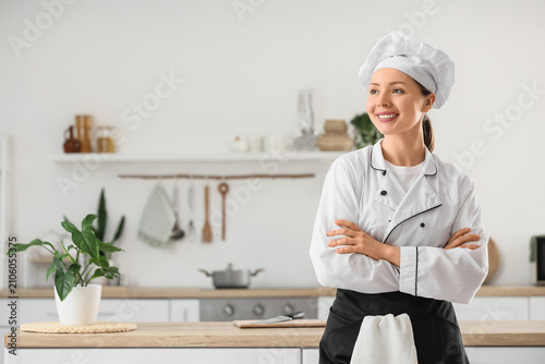 Smiling young female chef i...