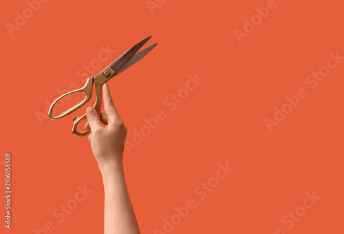 Female hand holding golden ...