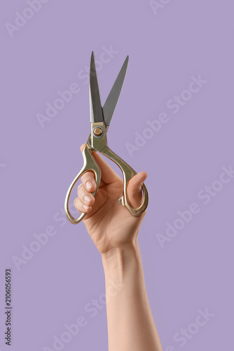 Female hand holding large g...