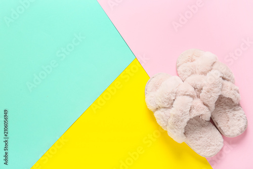 Soft pink slippers on color...