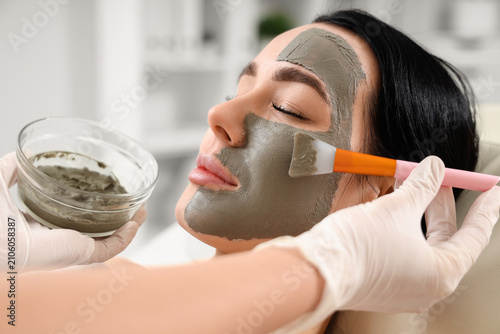 Cosmetologist with brush ap...
