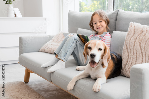 Cute little girl with Beagl...