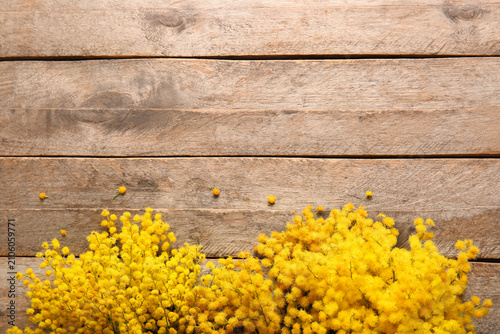 Mimosa flowers on wooden ba...