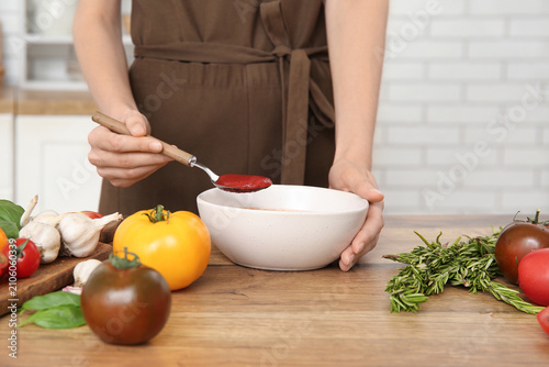Woman with bowl of fresh to...