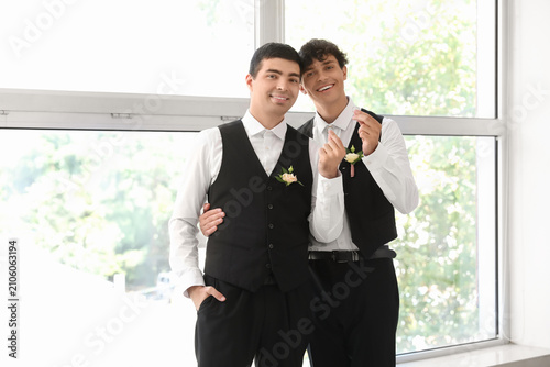 Happy gay couple making hea...
