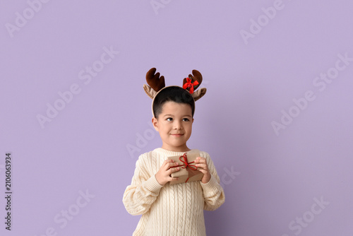 Cute little boy in deer hor...