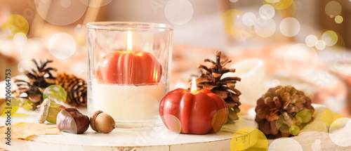 Autumn pumpkin candles with...