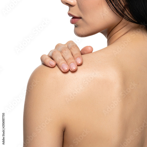 Female shoulder with hand touching smooth skin isolated white background