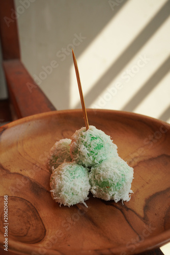 фотографія Rice cakes with coconut  on tge wooden plate