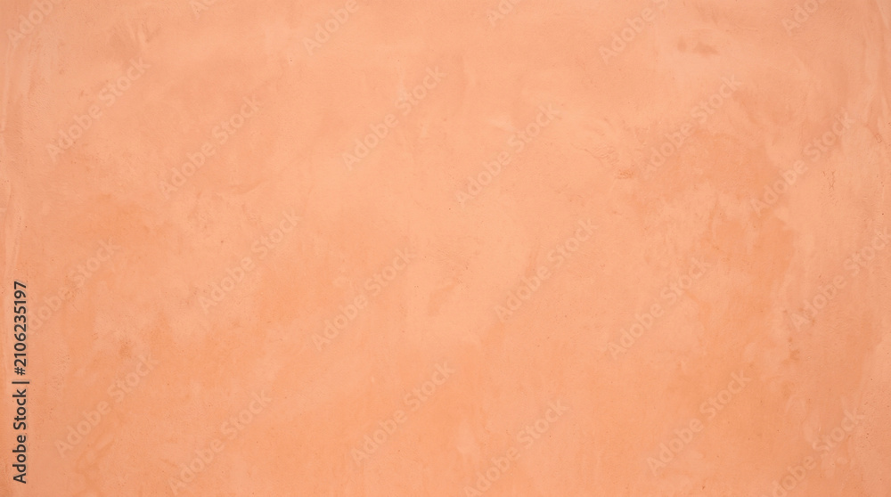 Fototapeta premium Soft peach salmon plaster wall texture background for warm minimal design