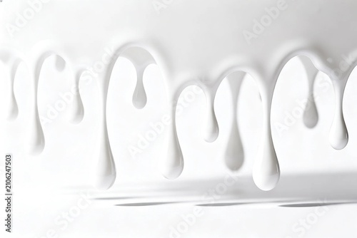 White Liquid Dripping Against Bright Background