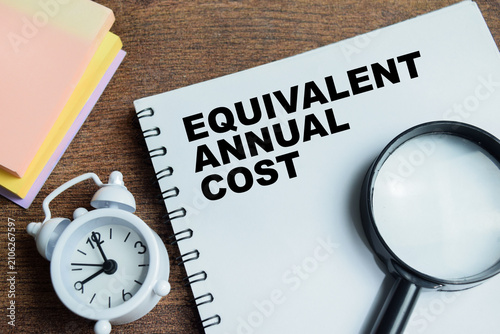 Photos Concept of equivalent annual cost write on book isolated on Wooden Table