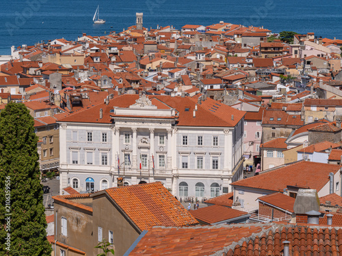 Historic coastal town with red roofs by the sea