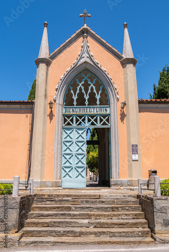 Gothic chapel entrance with open blue door