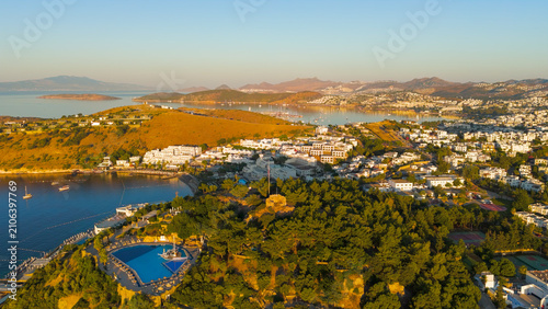 Bodrum, Turkey. Distant aerial drone view of Tiger Tower within restricted military zone. Ancient watchtower on wooded hilltop, visible from town but inaccessible to public.. Aerial View
