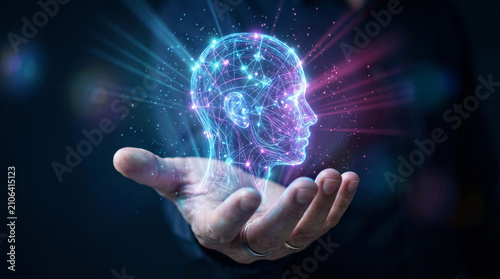 Deep learning neural network concept showing glowing wireframe human head with light rays held in hand representing advanced computational modeling