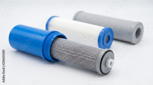 Water filtration cartridges isolated on white background for purification with cartridges lying displays water industrial technology horizontal