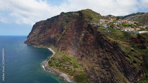 Faja dos Padres Madeira Portugal Aerial Drone Flyback Flight Along Steep Vertical Coastal Cliffs Terraces Green Fields Quinta Grande Village Camara de Lobos Atlantic Travel Video 4K UHD