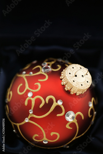 Elegant red holiday bauble with copy space