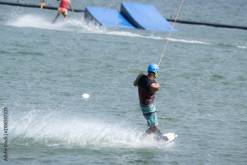 Cable Wakeboarder Riding on Lake in Summer