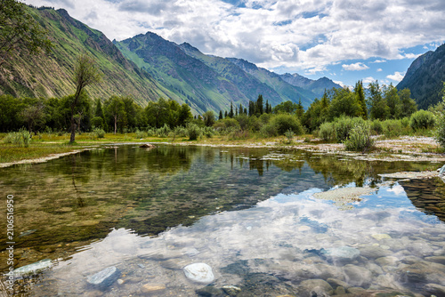 Obraz na plátně Crystal Stream Reflecting Mountain View in Xia Ta, Yili, Xinjiang, China