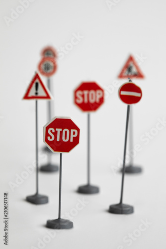 Miniature Road Traffic Signs Isolated on White Background