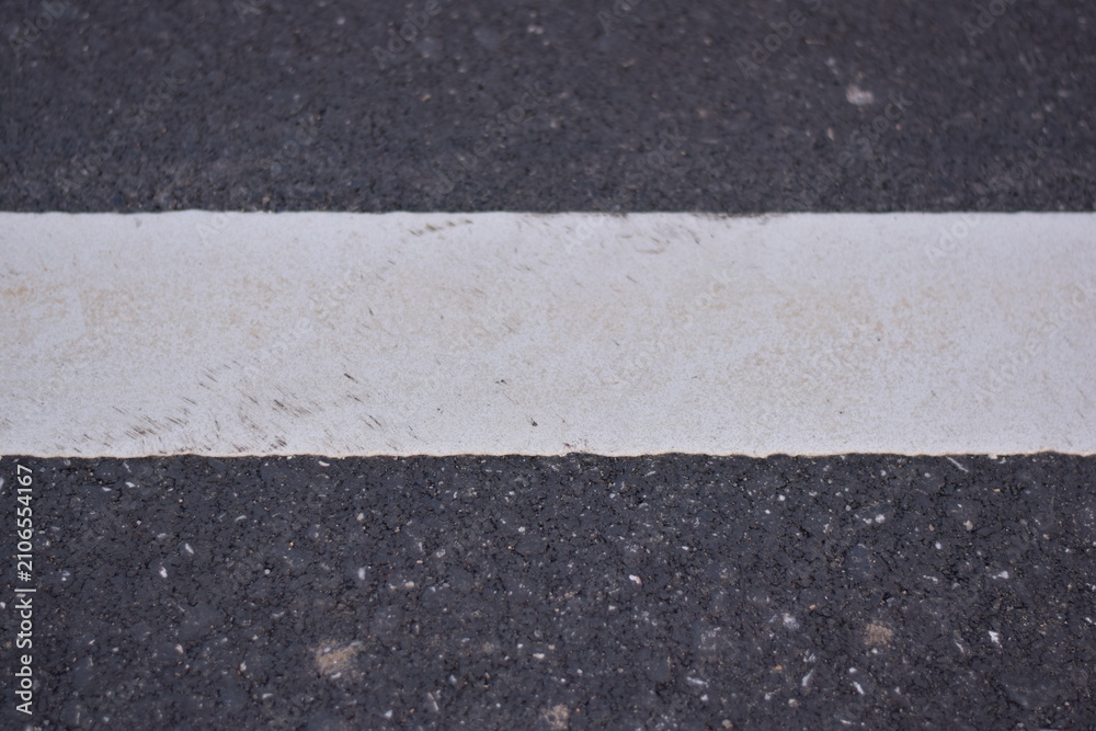 Fototapeta premium black asphalt road and white dividing lines, Asphaltic concrete road with yellow and white traffic lines, asphalt, road, surface, traffic, street, transportation, black, white, background, highway, li