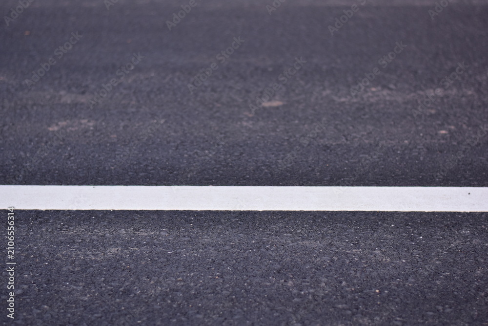 Fototapeta premium black asphalt road and white dividing lines, Asphaltic concrete road with yellow and white traffic lines, asphalt, road, surface, traffic, street, transportation, black, white, background, highway, li