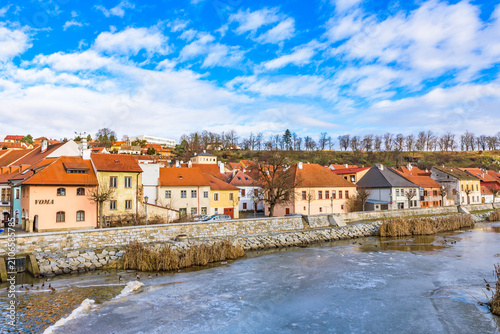 Frozen Jihlava River and colorful houses of the Jewish Quarter, a UNESCO World Heritage site in Trebic.