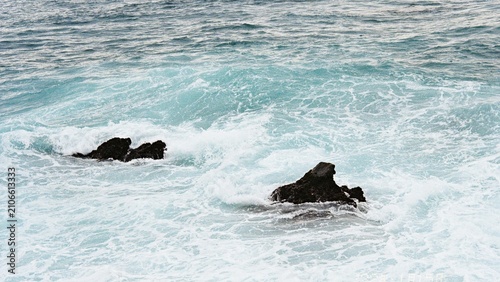 Konstfotografi Dark Volcanic Rocks Amidst Rough Turquoise Ocean Waves black sea wave