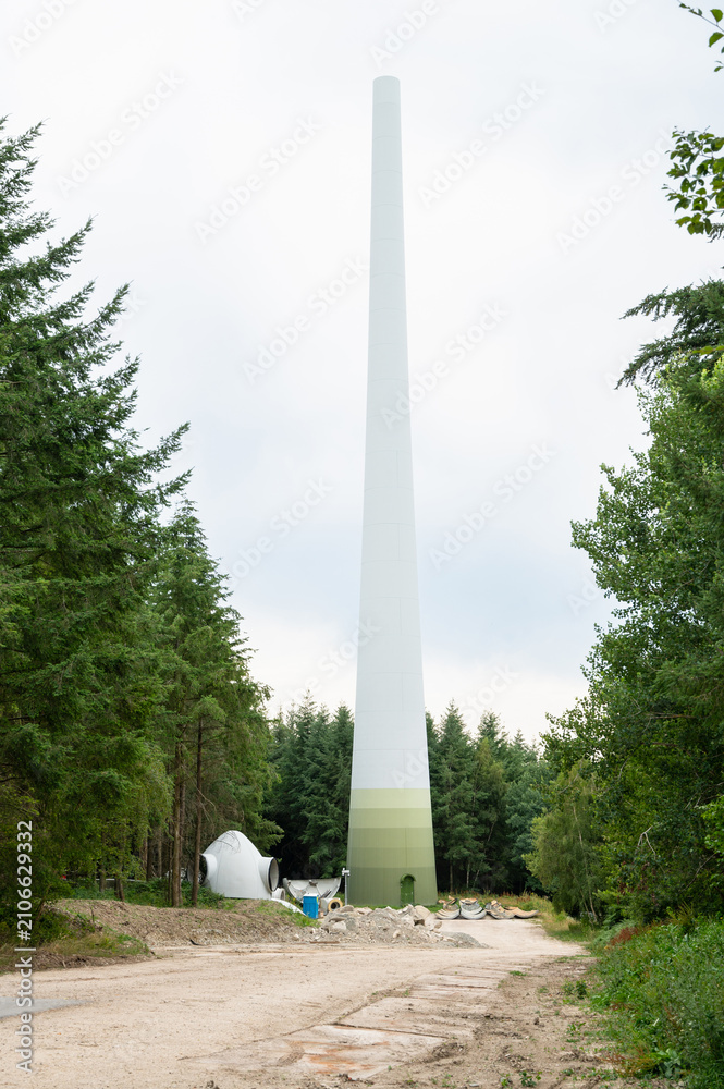 Fototapeta premium Expansion of renewable sustainable energy, building new wind turbine park, technology, environment and ecosystem in Germany, deforestation of forest