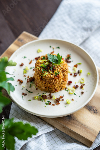 Homemade couscous with chicken and vegetables served on plate