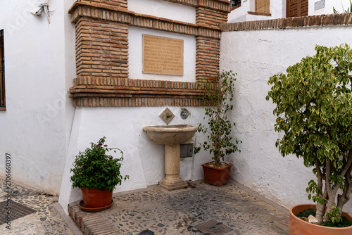 Traditional Stone Fountain in Whitewashed Andalusian Village Street