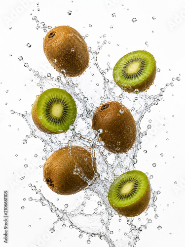 Fresh Whole and Sliced Kiwis Splashing in Water.