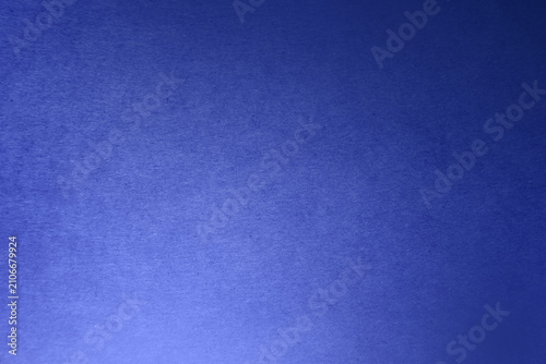 Foto Dark deep blue tone colour paint on rough paper texture background minimal style