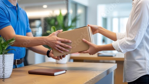 Two business professionals shaking hands over a wooden table with contract papers and a pen handshake