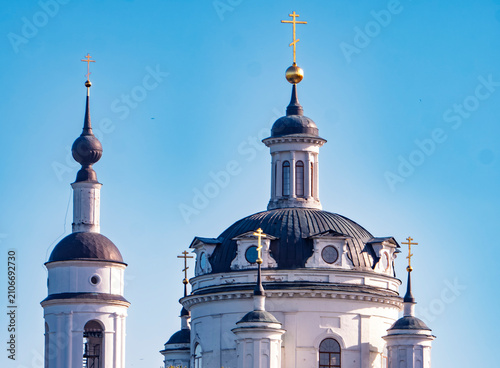 Photos Russian Orthodox church domes with golden crosses against clear blue sky