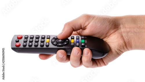 Isolated male hand holding modern television remote control and pressing a button