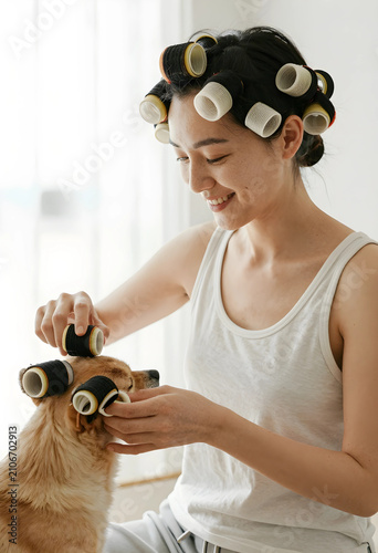 Smiling woman with hair rol...