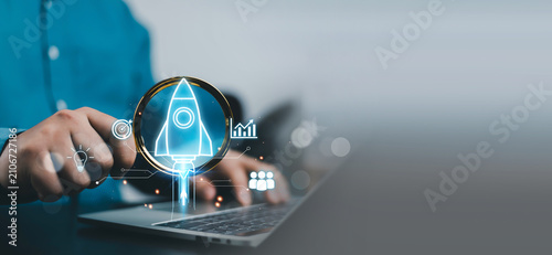 Bild auf Leinwand Business startup growth concept with rocket launch icon on laptop