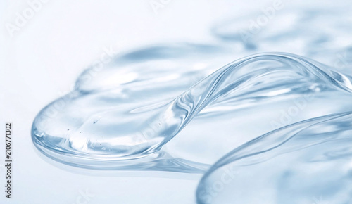 Transparent cosmetic gel texture swirl on white background
