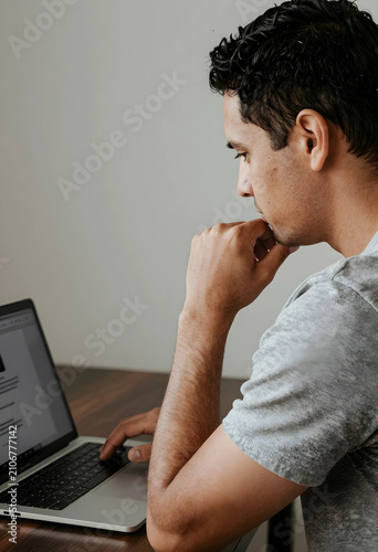 Thoughtful young man workin...