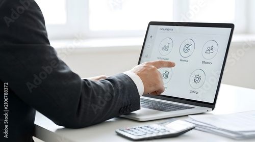 Data analytics technology business professional analyzing performance metrics on laptop for strategic insights