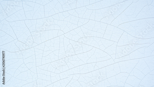 Cracked pale blue paint texture on old wood wall background