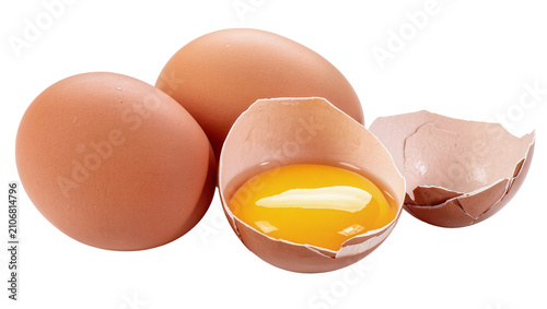Isolated raw brown eggs, one cracked open showcasing vibrant orange yolk inside the shell